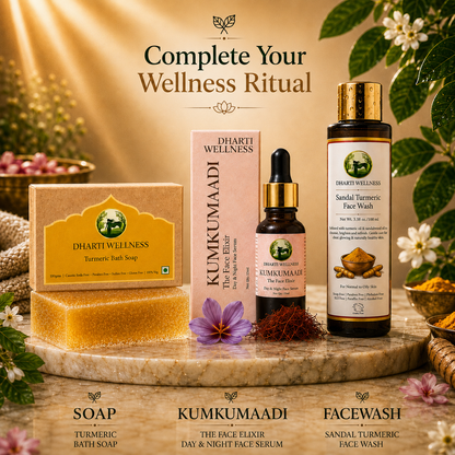 Four Dharti Wellness skincare products arranged on a marble slab with decorative flowers and leaves: a turmeric soap bar in a gold-labeled box, a Kumkumaadi face serum bottle, a face wash bottle, and a turmeric bath soap bar. Text at the top reads 'Complete Your Wellness Ritual' and labels below identify each product.